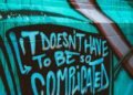 teal and white graffiti wall
