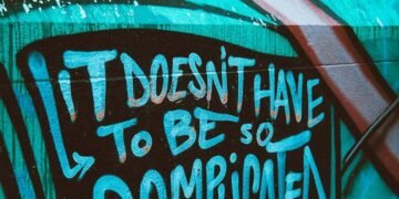 teal and white graffiti wall